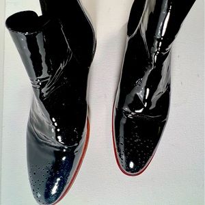 Black patent pull-on flat booties from Paris. Almost new. Barely worn